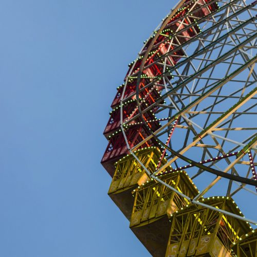 low-angle-giant-wheel-with-blue-sky